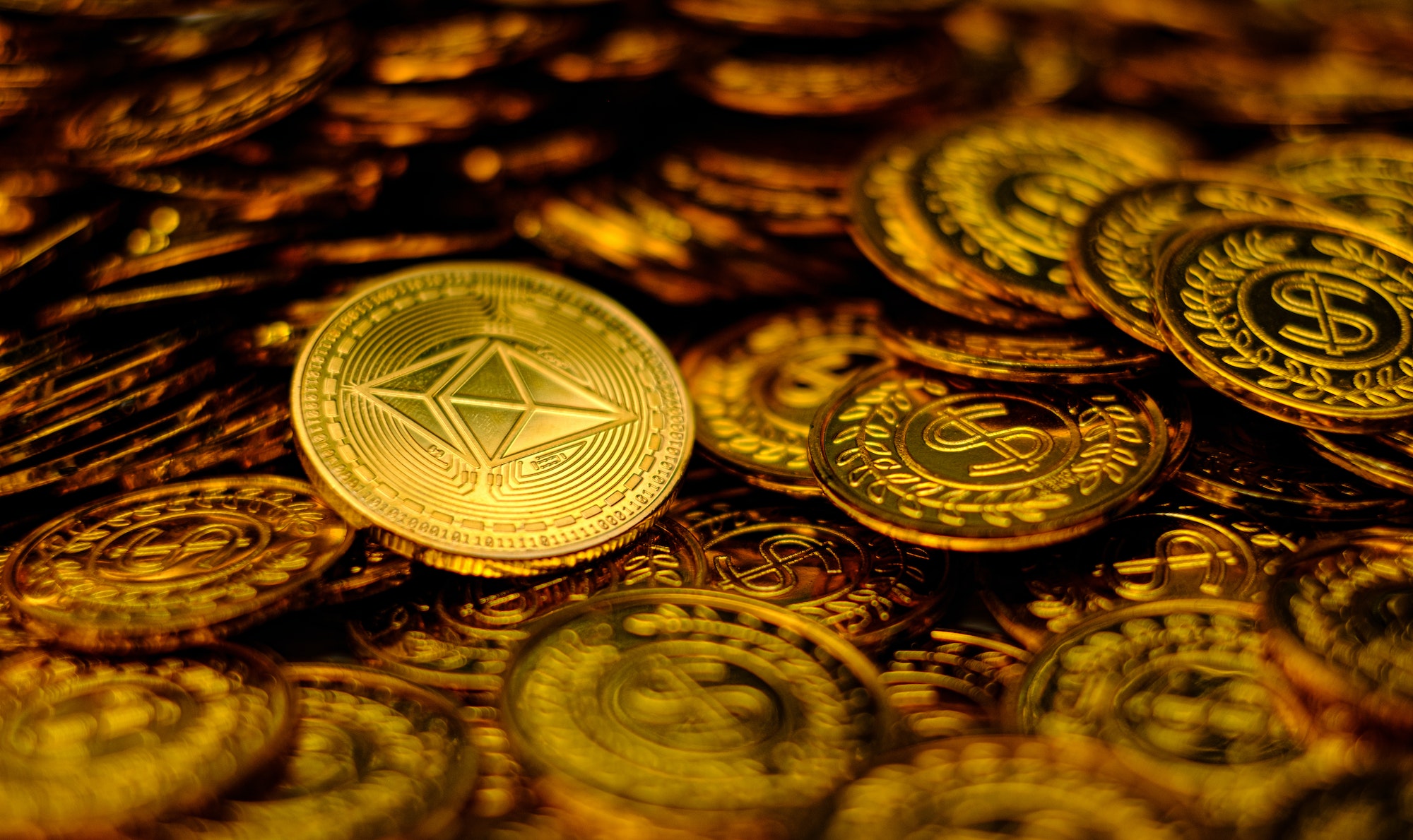 Ethereum coin cryptocurrency on pile gold coins a lot of